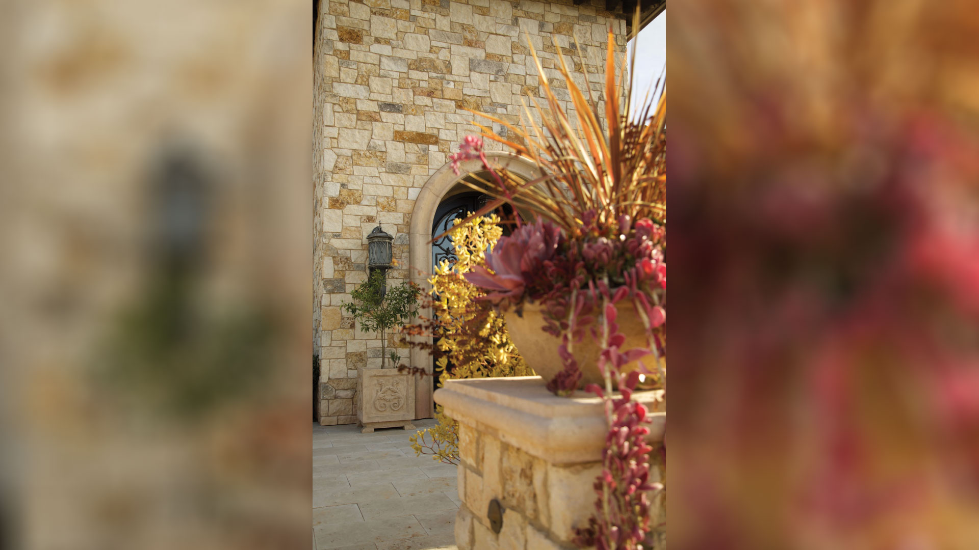 entrance to home with cottage cream traditional thin veneer installed on exterior