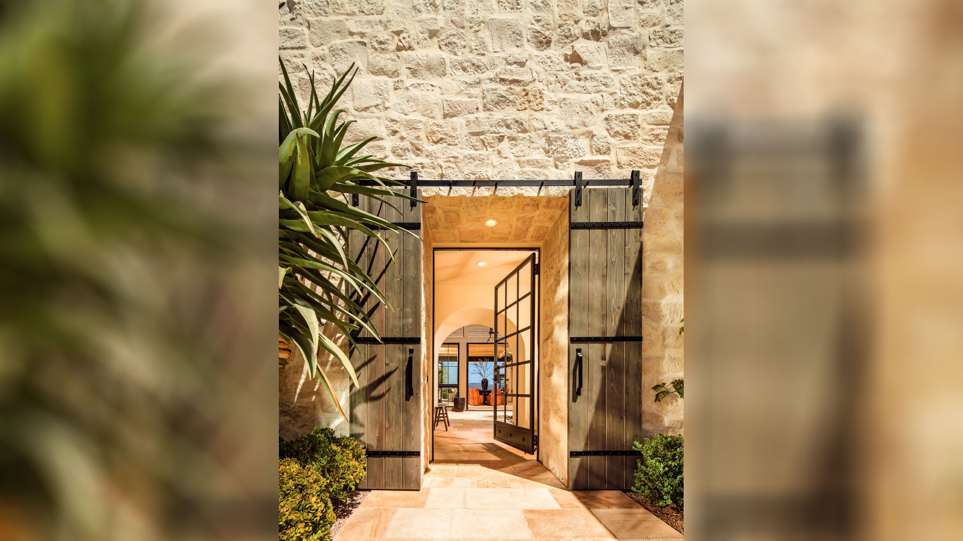 Front entryway to home with Honey Buff Rubble thin veneer installed on exterior of home