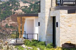 Exterior of home with Nadia Neo Ledge: Sawn thin veneer exterior