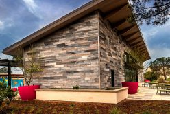 Camilla Neo Planks installed on a retaining wall around a building