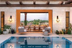 Camilla Pillowed Ledge natural stone thin veneer installed on interior walls of outdoor pool area