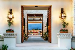 Camilla Pillowed Ledge natural stone thin veneer installed on exterior walls and outdoor pool patio