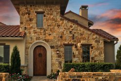 Ashwood Rubble natural stone thin veneer installed on exterior walls of a home