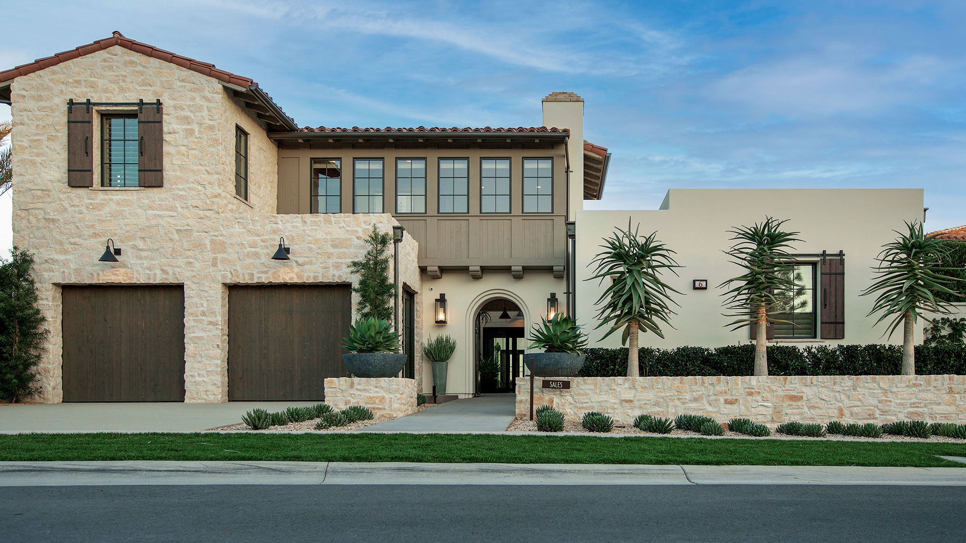 home with double garage Rhinestone Rubble thin veneer installed on exterior walls