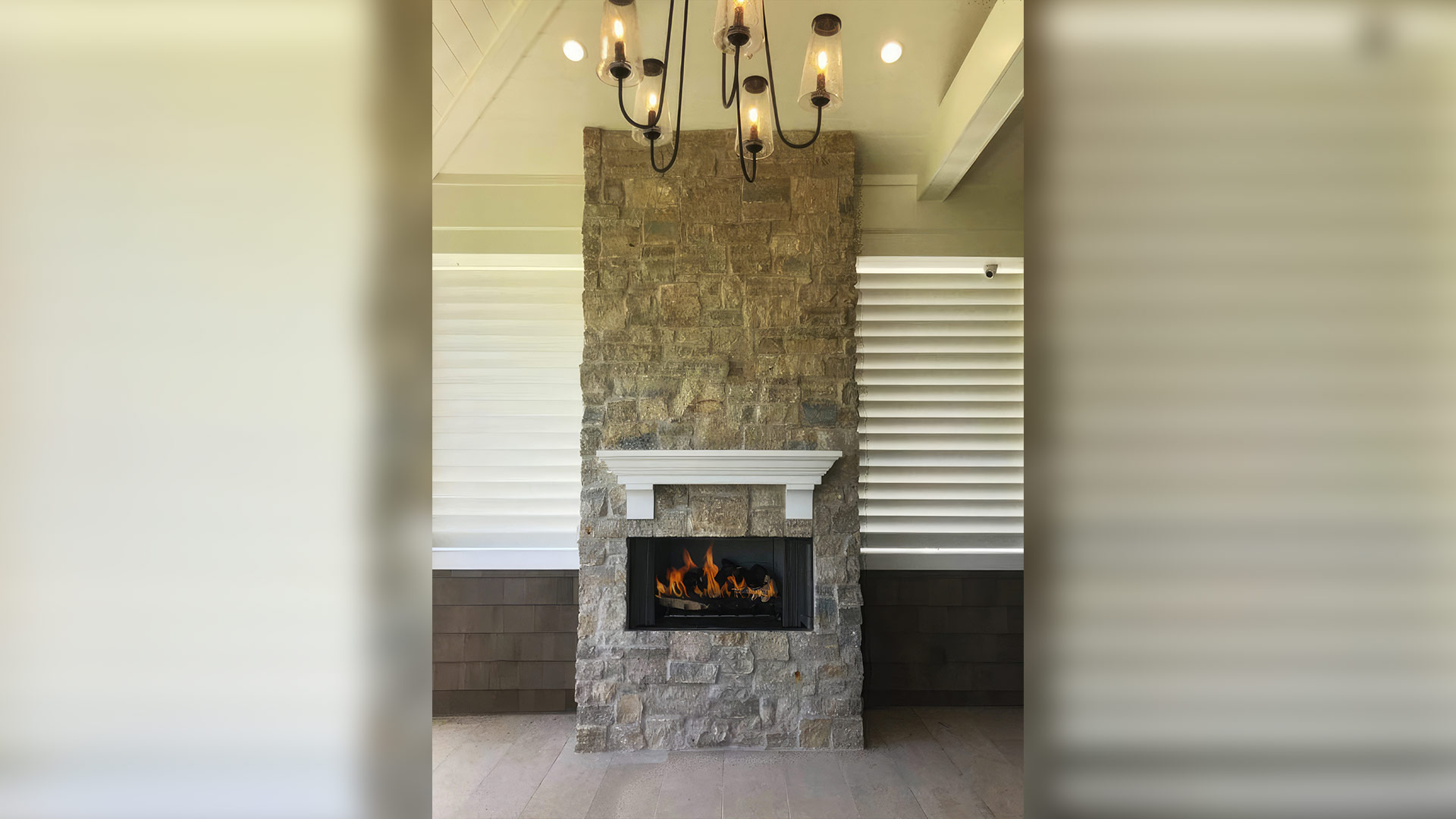 Tundra Cream Rubble natural stone thin veneer installed on custom fireplace.