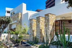 Tuscan Blend Rubble natural stone thin veneer installed on exterior of commercial building.