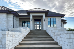Blanco Traditional natural stone thin veneer installed on exterior of home.