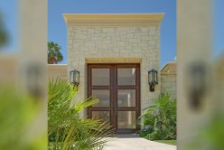 front of home with exterior walls installed with cream traditional thin veneer