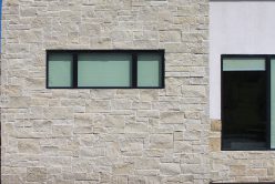 front of home exterior wall installed with regent buff traditional thin veneer