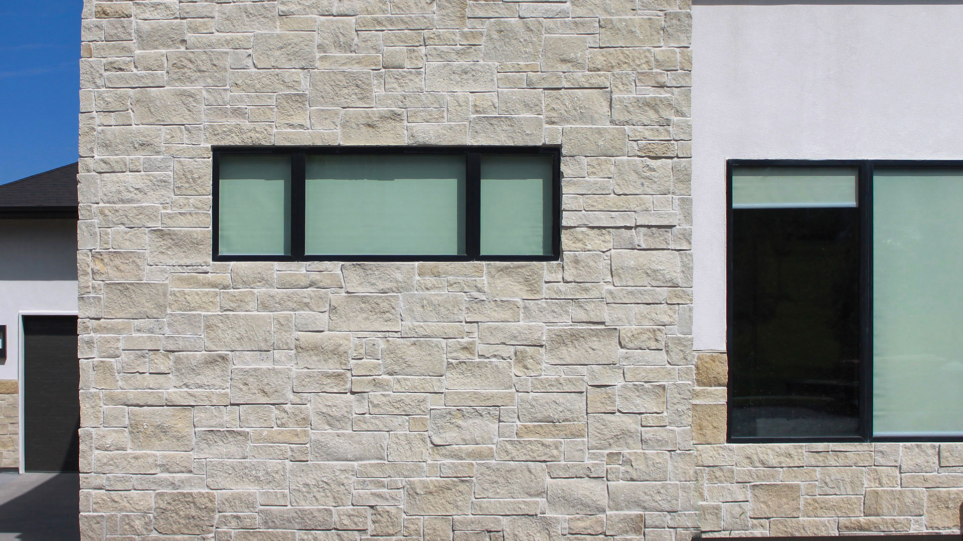 front of home exterior wall installed with regent buff traditional thin veneer