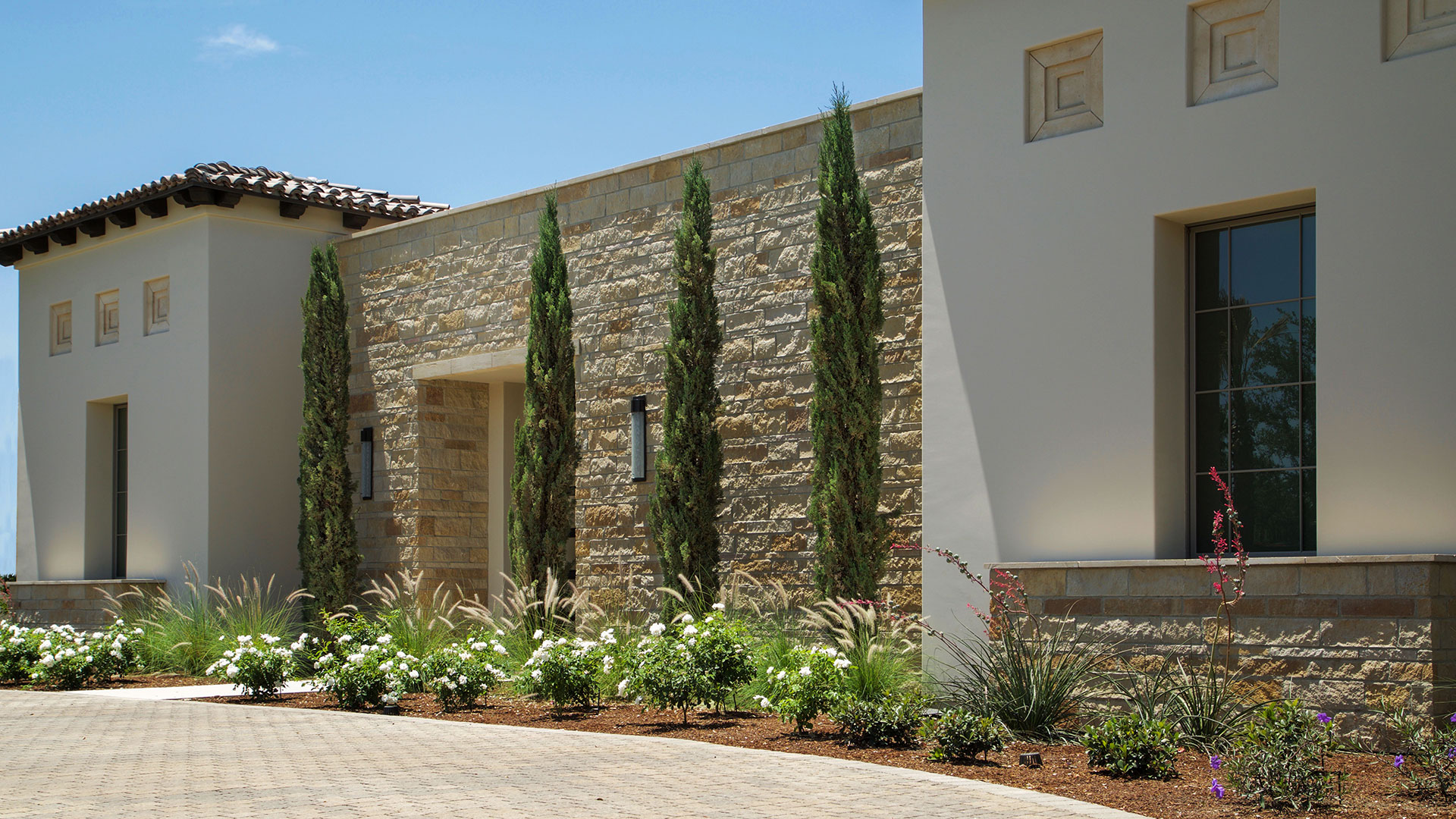 front of home with dark antique traditional natural stone thin veneer installed on exterior of home