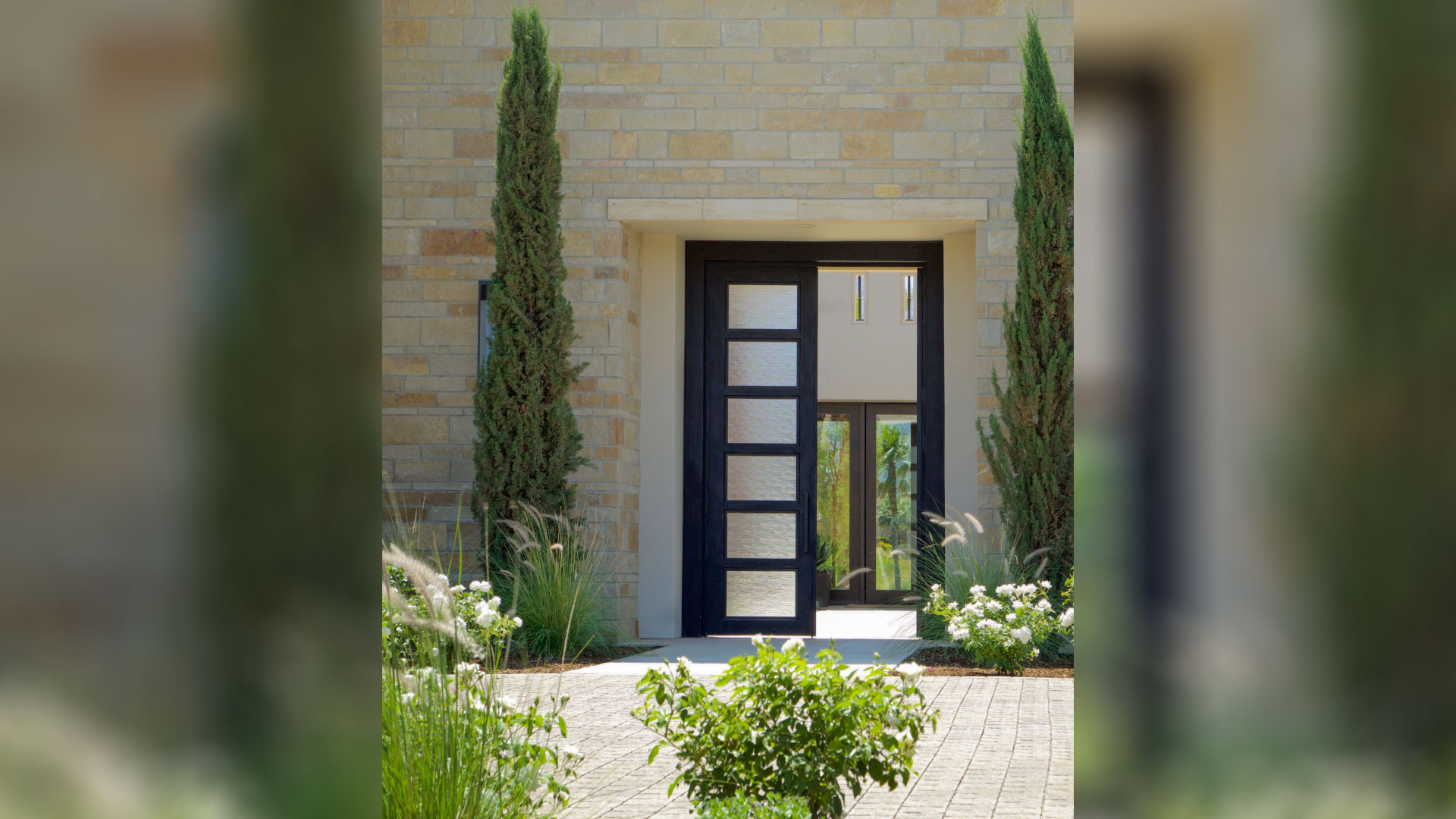 front of home with dark antique traditional natural stone thin veneer installed on exterior of home