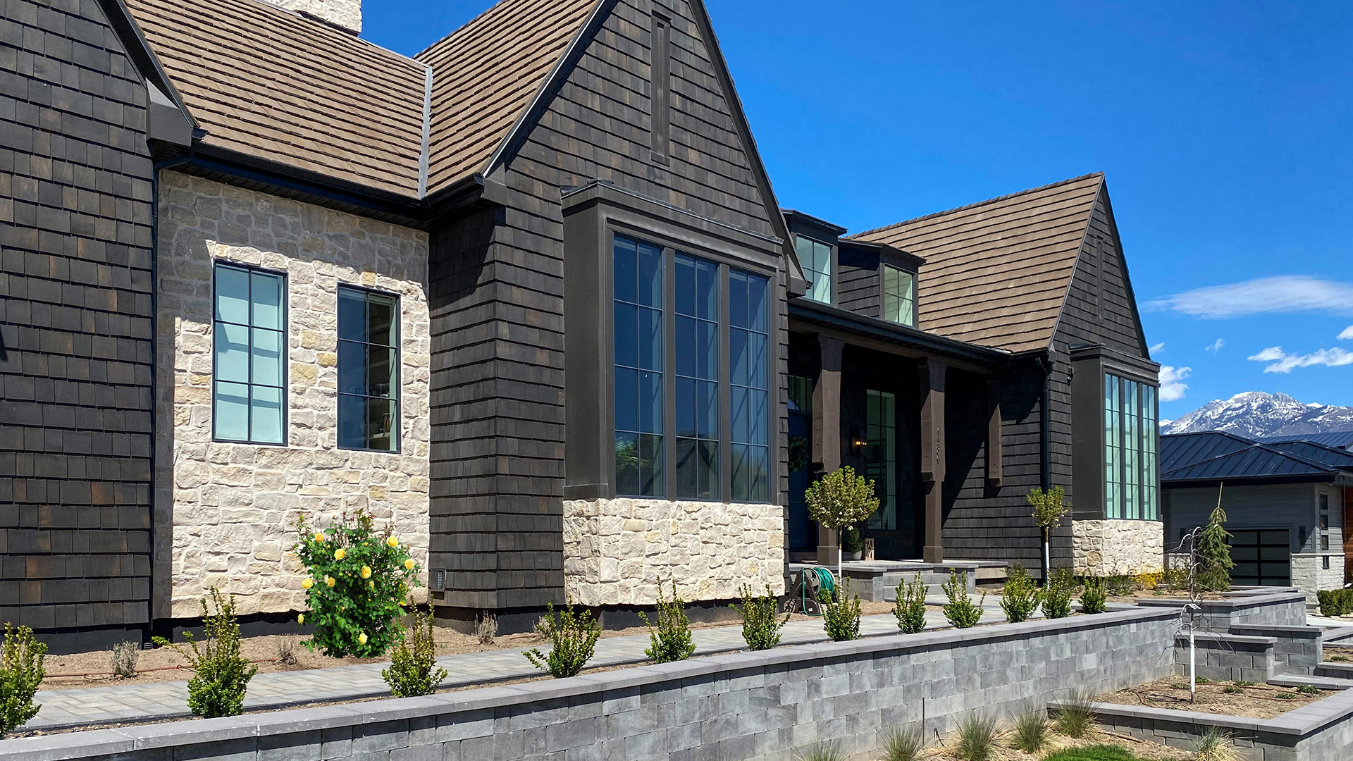 Tundra Cream Rubble natural stone thin veneer installed on exterior of custom home.