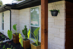 Blanco Traditional natural stone thin veneer installed on exterior of home.