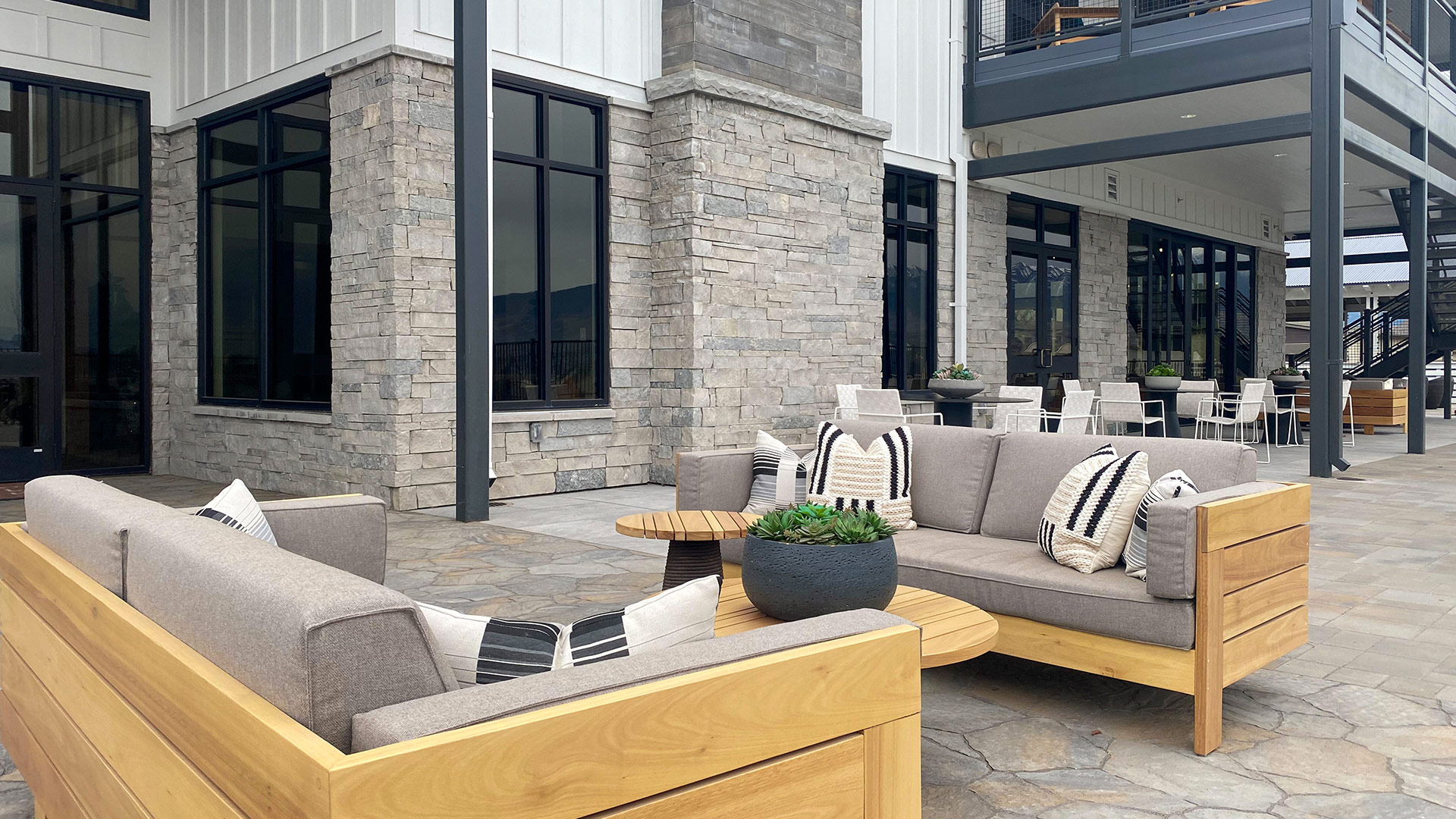 Mission Blue Traditional natural stone thin veneer installed on exterior walls of commercial building.