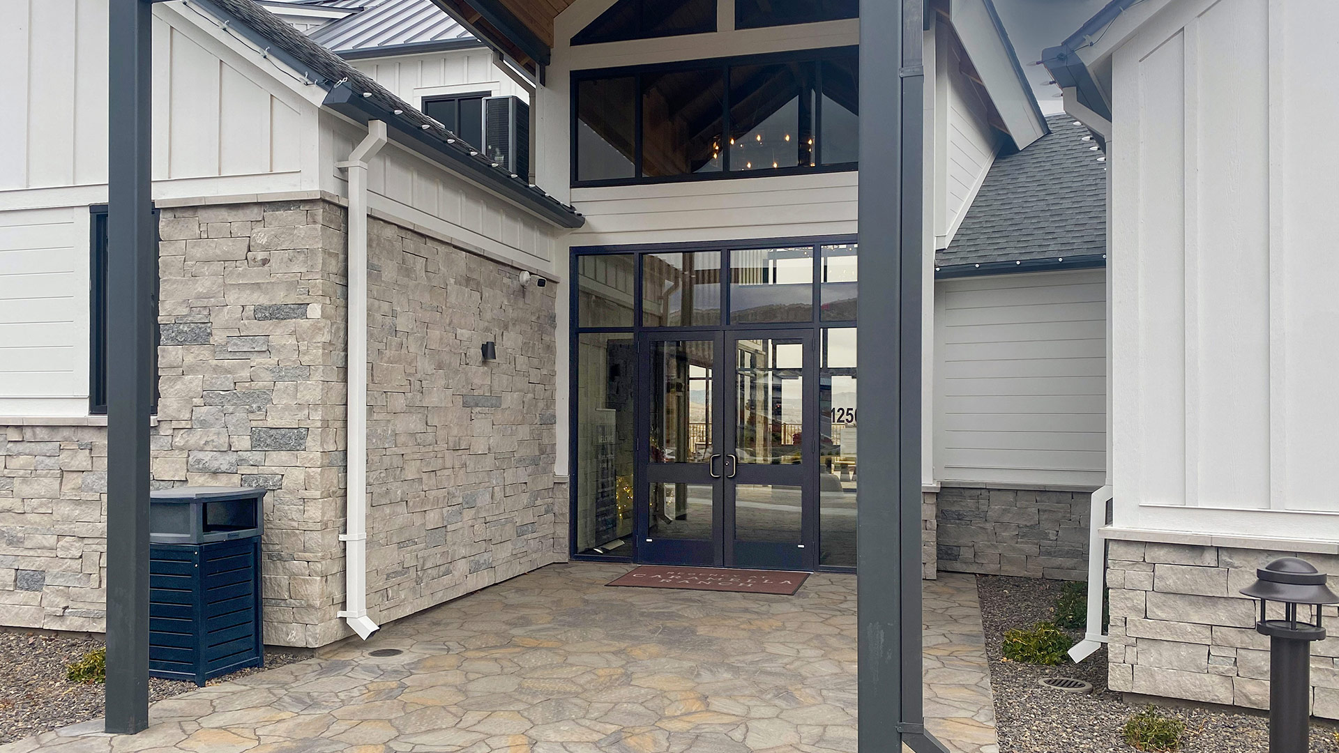 Mission Blue Traditional natural stone thin veneer installed on exterior walls of commercial building.